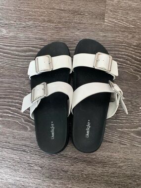 Limelight White Buckle Strap Sandals with Black Footbed